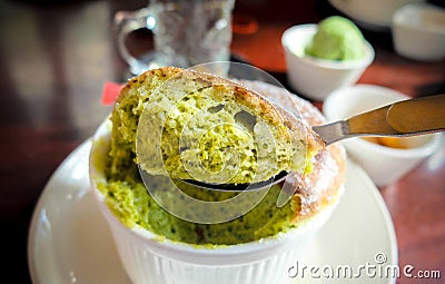 Delicious green tea souffle on table Stock Photo
