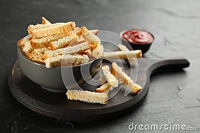 Delicious hard chucks in bowl on black table Stock Photo