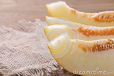 Delicious, healthy, fresh melon slices on a black table Stock Photo