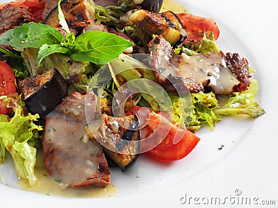 Delicious healthy warm salad with beef and vegetables Stock Photo