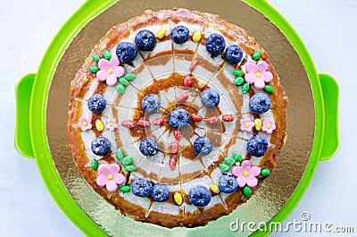 Delicious homemade cake, top view. cake is decorated with blueberries and cream. Cute birthday cake Stock Photo