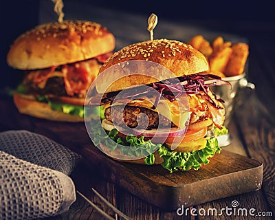 Delicious homemade hamburger on wooden background Stock Photo