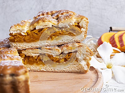 Delicious homemade pie tart with pumpkin, cabbage filling, close up, round, cut piece Stock Photo