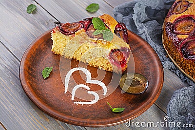 Delicious homemade plum pie on wooden background Stock Photo