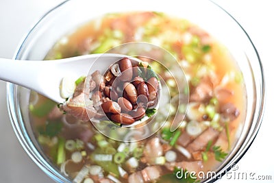 Delicious hot and spicy pork meat along with red beans in the soup Stock Photo