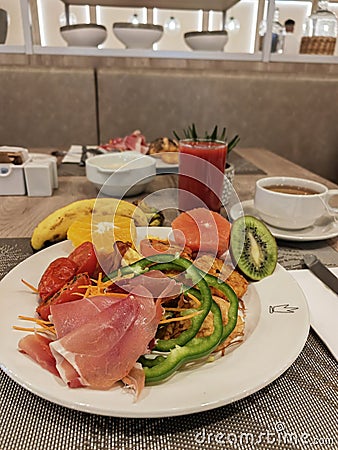 Delicious hotel breakfast buffet. Eating breakfast or brunch in a restaurant. Fresh fruits like kiwi, banana, orange, grapefruit Stock Photo