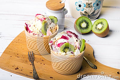 Delicious ice cream in a cup with tasty fruits Stock Photo
