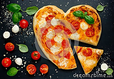 Delicious Italian pizza with cherry tomatoes, mozzarella and basil Stock Photo