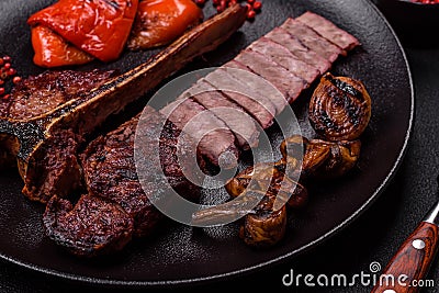 Delicious juicy beef tbone steak with salt, spices and herbs Stock Photo