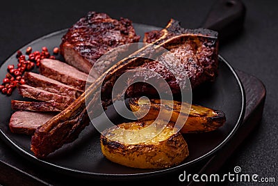 Delicious juicy beef tbone steak with salt, spices and herbs Stock Photo