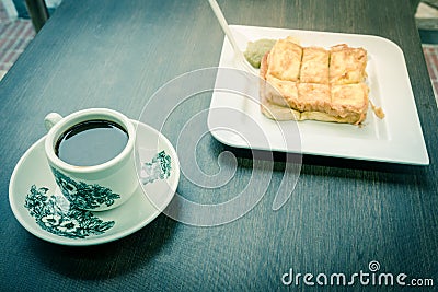 Delicious Kaya toast with jam and kopitiam coffee mug in traditional Chinese breakfast Stock Photo