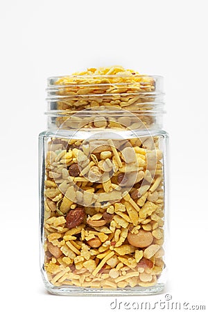 Delicious Khatta Meetha in a glass jar, made with peanuts, sugar, raisins, and besan sev. Stock Photo