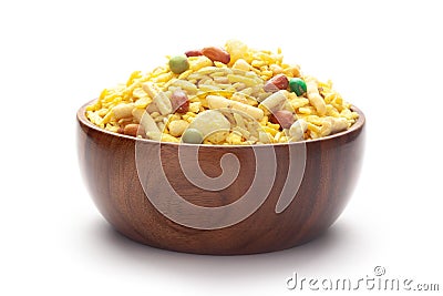 Delicious Khatta Meetha In hand-made handcrafted wooden bowl, made with peanuts, sugar, raisins, and besan sev. Pile of Indian Stock Photo