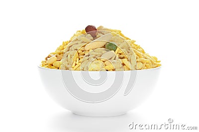 Delicious Khatta Meetha in a white Ceramic bowl, made with peanuts, sugar, raisins, Stock Photo