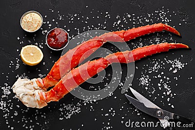 Delicious king crab legs with eating tools top view Stock Photo