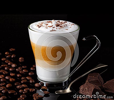 Latte macchiato with coffee beans an chocolate chunks Stock Photo