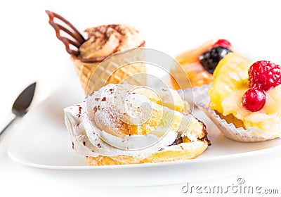 Delicious little cream cake near cake with chocolate and fruit Stock Photo