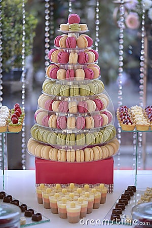 Delicious macaroons on candy bar Stock Photo