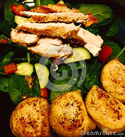 Delicious meal cooked cuisine dinner fresh vegetables chicken and perogies Stock Photo