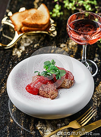 Delicious meat pate foie gras on plate with berry sauce, sprouts and toasts on marble background with drinks. Healthy food, top Stock Photo