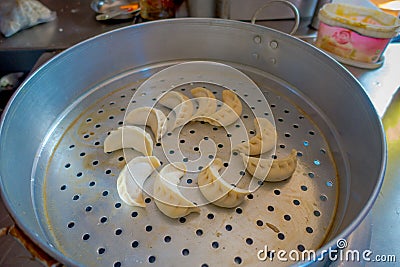 Delicious momo food over a metallic tray in the kitchen, type of South Asian dumpling native to Tibet, Nepal, Bhutan and Stock Photo