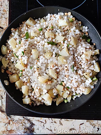 Delicious mouth watering delicacy prepared with potatoes peanuts green chillies and sagos Stock Photo