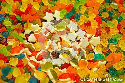 Delicious multi-colored fruit marmalade. unhealthy bright candies in bulk. different jelly photo close. tasty sweets in the candy Editorial Stock Photo