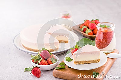 Delicious and nutritious handmade strawberry no bake frozen gradient colour fromage frais cheesecake slice with raw sarcocarp Stock Photo
