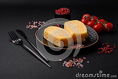 Delicious omelet with milk, spices and herbs cut into large pieces Stock Photo