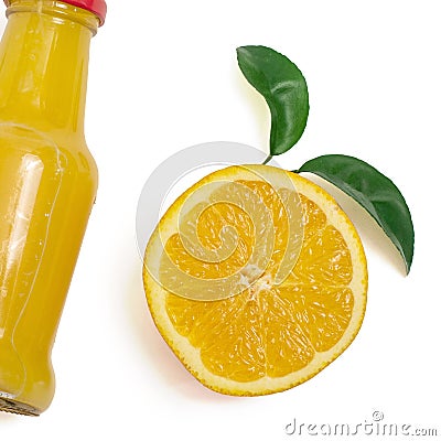 Delicious orange juice in a bottle and slice of orange next to it. Isolated on white. Top view Stock Photo