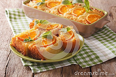 Delicious orange pie syrup soaked close-up. horizontal Stock Photo