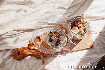 Delicious overnight oats with banana and walnuts minimalistic sunny shot walnuts banana sustainable concept Stock Photo