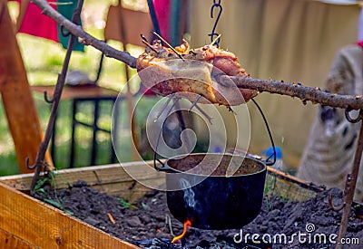 Delicious pork meat grilling on fire skewer Stock Photo
