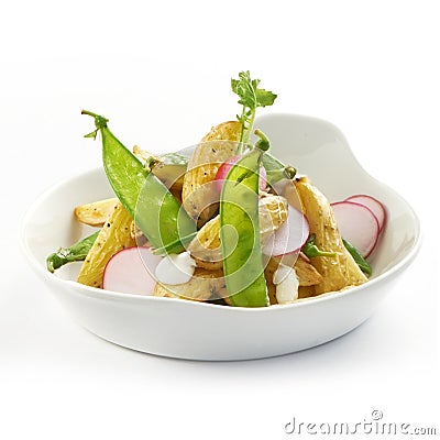 Delicious potato salad with raddish and sugarsnaps Stock Photo