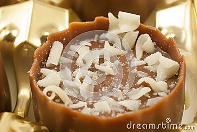 Delicious praline garnished with delicious milk chocolate flakes Stock Photo