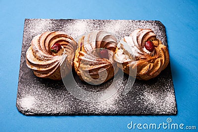 Delicious profiterole, french puff pastry eclairs Stock Photo