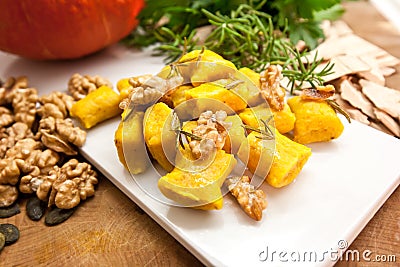 Delicious pumpkin gnocchi with sage leaves, walnuts and olive oil, vegan food Stock Photo