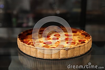 Delicious quiche with shrimps on counter in bakery shop. Space for text Stock Photo