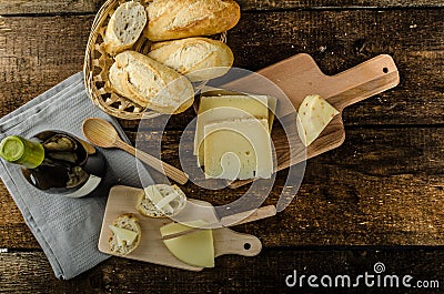 Delicious ripe cheese with crispy baguette and wine Stock Photo