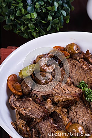 Roast beef with roasted potato, carrots, celery and shiitake mushroom Stock Photo