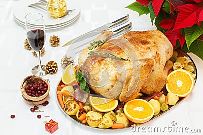 Delicious roasted turkey on Christmas decorated table Stock Photo