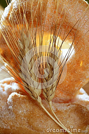 Delicious roll bakery sugar and wheat spikes Stock Photo