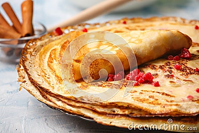 Delicious Russian pancakes with sour cream and honey cooked Stock Photo