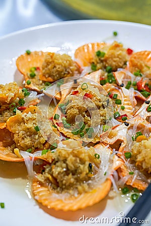 Delicious seafood dishes Steamed large scallops with garlic Stock Photo