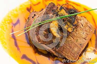 Delicious sirloin steak placed upon a bed of curry Stock Photo