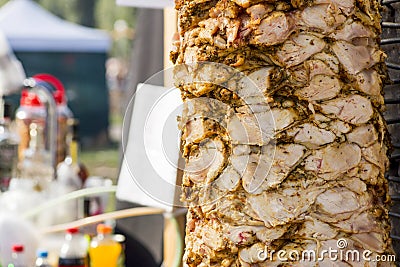 Delicious slabs of skewered fast food shawerma chicken meat turn on a spit Stock Photo