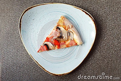 Slice of pizza on plate. Italian cuisine Stock Photo