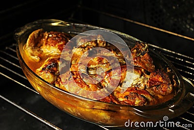 Delicious sliced baked chicken in the oven Stock Photo