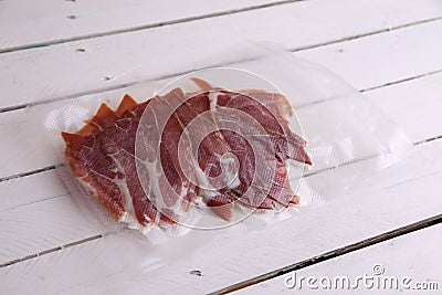 Delicious sliced Spanish dry-cured Jamon ham Stock Photo