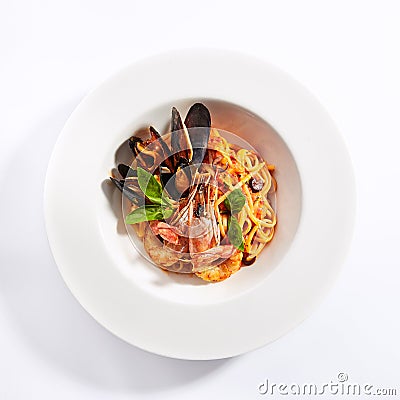 Delicious spaghetti with seafood and tomatoes Stock Photo